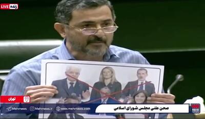  ببینید | پاره کردن تصاویر برخی سران غربی جسارت کننده به رهبری در صحن علنی مجلس