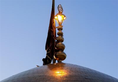  تعویض پرچم بارگاه منور رضوی - تسنیم