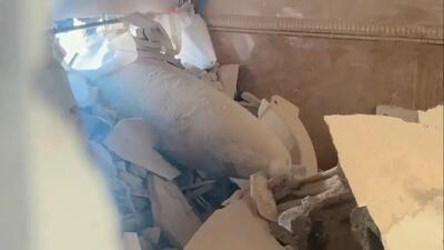  موشک عمل‌نکرده وسط دیوار یک ساختمان در تهران