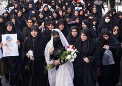  چادر سفید و شاخه گل همسر شهید محمد نقوی روایتگر همه چیز است