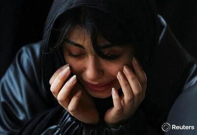  تصاویر رویترز از خاکسپاری شهدای حملات آمریکا و اسرائیل به مناطق مسکونی تهران، در بهشت زهرا