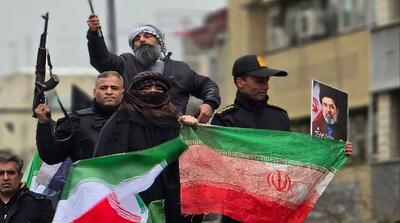 تصاویر پرچم آغشته به خون شهید راهپیمایی روز قدس