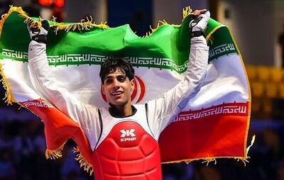  تقدیم مدال طلای قهرمانی تکواندو نوجوانان جهان به شهدای مدرسه میناب