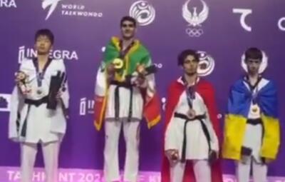  طنین سرود و اهتزاز پرچم مقدس جمهوری اسلامی ایران در سالن المپیک شهر تاشکند