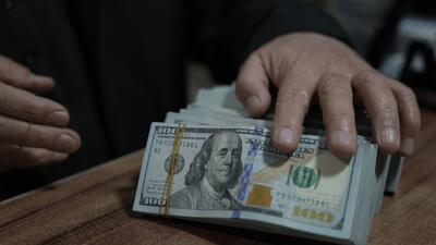  دلار تراولی به زیر قیمت بازار آزاد رفت