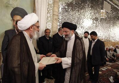  بازنشر تصویری از مراسم اعطای حکم خادمی آیت‌الله شهید سید ابراهیم رئیسی - تسنیم