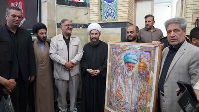  رونمایی ازطرح تابلوفرش نفیس ابریشمین با طرح «شهید امت» در خوی + عکس