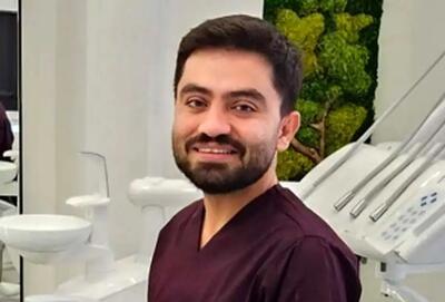 شعارنویسی روی دیوار مطب یک دندانپزشک