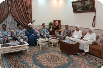  تجلیل مرزبانان کنگان از خانواده شهید اهل‌سنت احمد عبدالله‌زاده - تسنیم