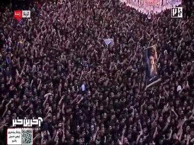  تصویر آقای شهید ایران در دست عزاداران حسینی در کربلای معلی