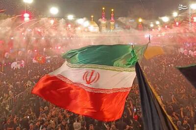  عکس/ برافراشته‌شدن پرچم ایران در بین‌الحرمین