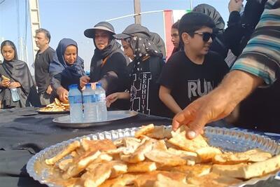  برافراشتن پرچم ارادت مردم سوق  در جاده‌های خوزستان فیلم - تسنیم