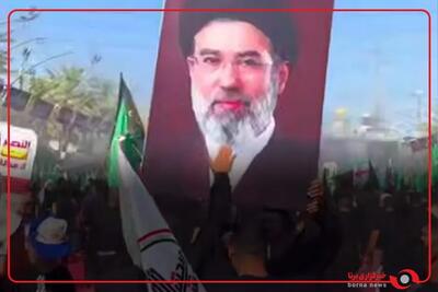 پرچم ایران و تصویر رهبر انقلاب بر دوش نیروهای امنیتی عراق