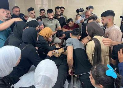  تصاویری از آخرین وداع یک خانواده فلسطینی با جسد فرزند شهیدشان