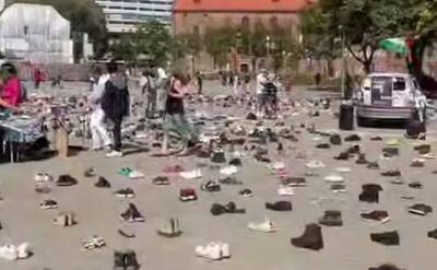  فیلم/ نمایش کفش‌های کودکان شهید غزه در برلین