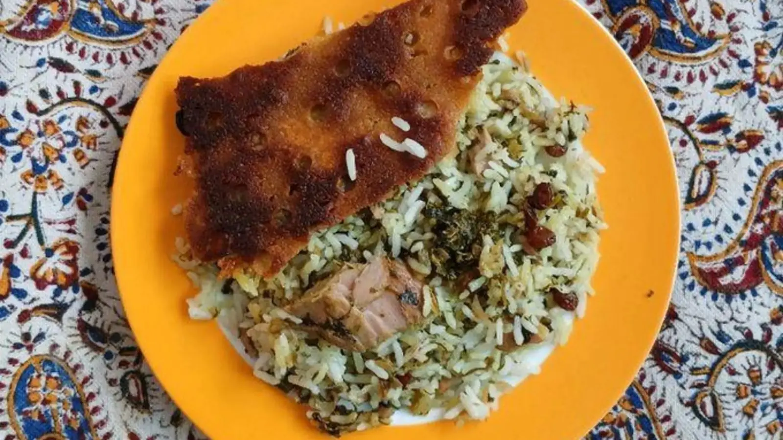 طرز تهیه مگشت پلو جنوبی؛ امگشت پلو خوزستانی با ماهی، کشمش و سبزی