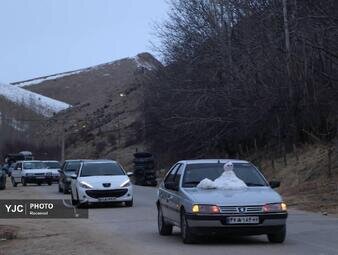 گردشگران در صف برف و سرما در مسیر پیست اسکی سپیدان