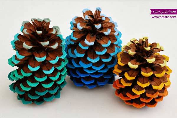 	نمونه‌های زیبا از تزیین میوه کاج با اکلیل و رنگ